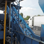Hinged Belt Conveyor at recycling facility - Jorgensen